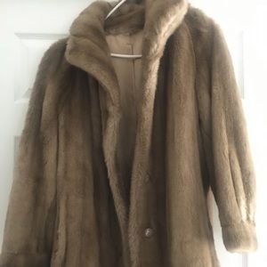 Long about knee length brown fur coat